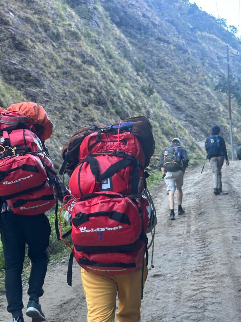 cold feet porters carrying duffel bag